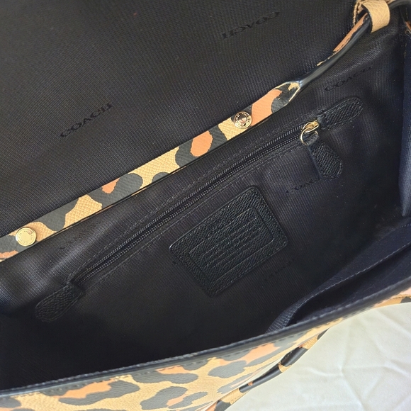 Coach Clutch in ocelot / leopard crossgrain leather